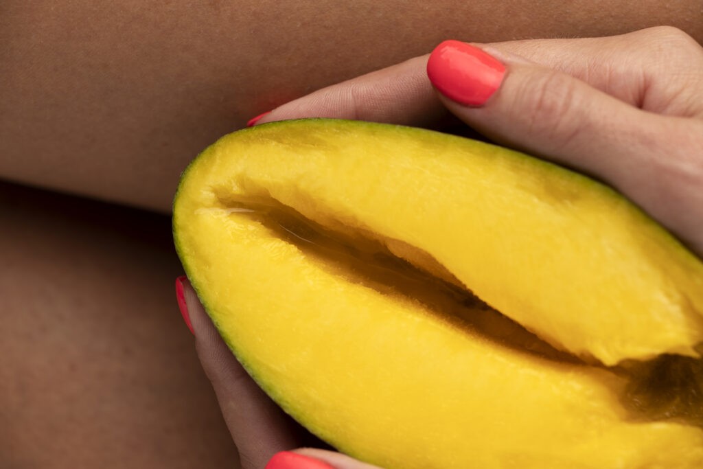 top view hands holding mango